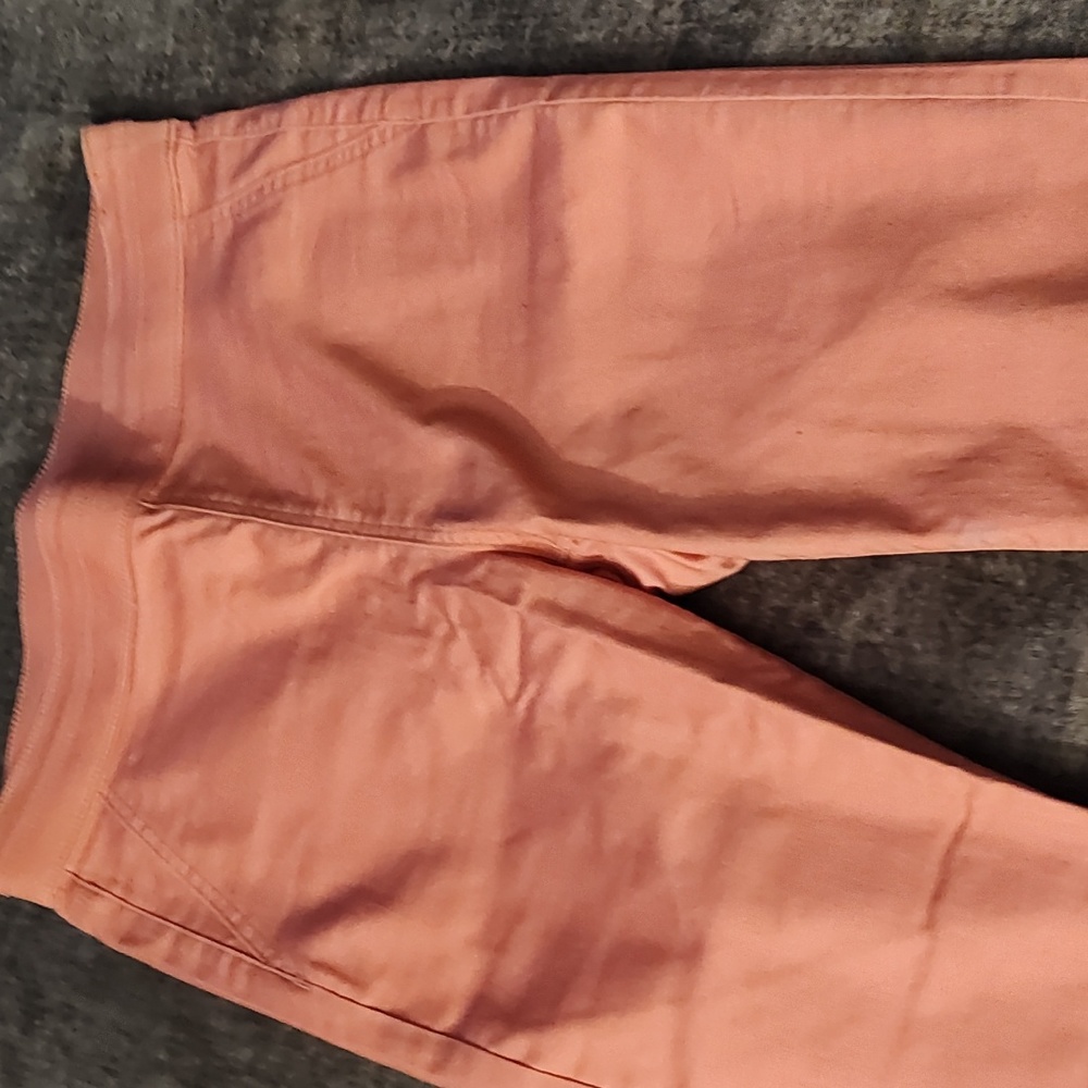 Peach/pink colored ankle jeans size large